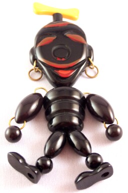 BP255 black bakelite jointed African man pin